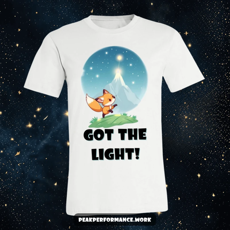 Funny T-Shirt: Playful fox cub energetically chases a glowing light particle up a mountain, embodying curiosity.