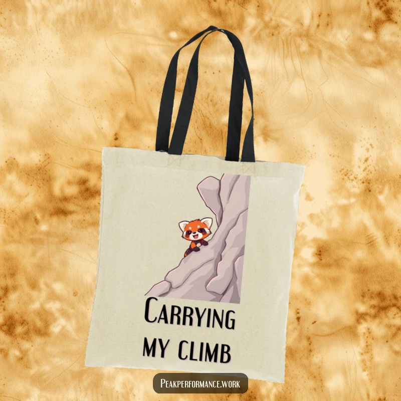 Funny tote bag showcasing a smiling cartoon red panda enthusiastically climbing a steep, rocky slope, ready for any journey.